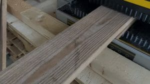 inserting wood into planer